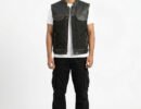 Men's black denim biker vest with cowhide leather trim, zip pockets, and adjustable side waist belts.
