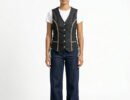 Women's black denim vest top featuring black leather braiding, side laces, and a snap-front closure.