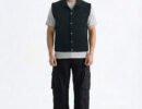 Men's black denim vest featuring a Kent collar, dual zipper and snap button closure, and front breast pockets.