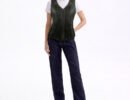 Women’s motorcycle vest in black leather featuring adjustable stretchable sides and decorative front lace detailing.
